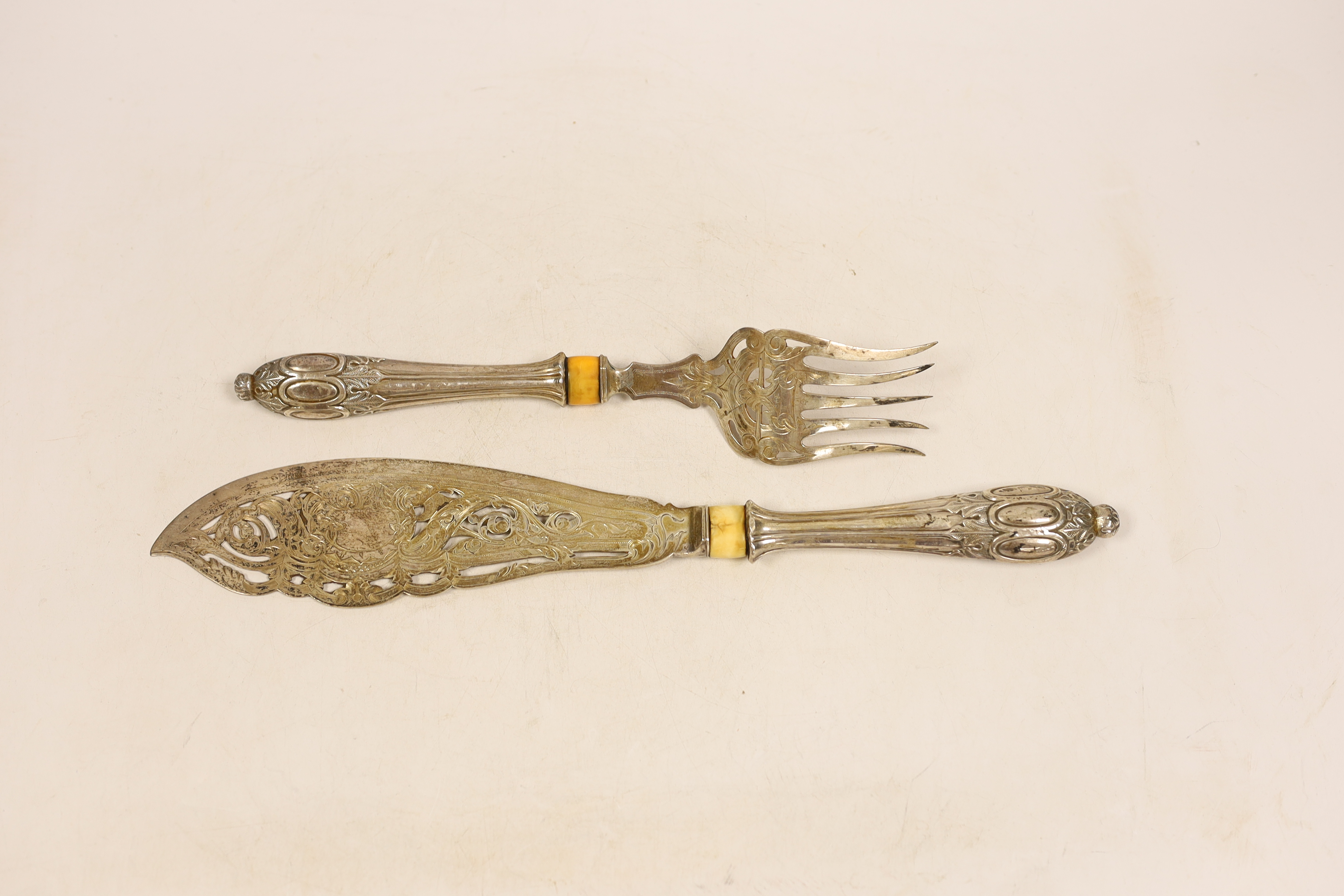 A pair of Victorian silver fish servers engraved and pierced decoration and silver handles (filled), Atkin Brothers, Sheffield 1863, knife 34.4cm. CITES Submission reference Z5185TNK